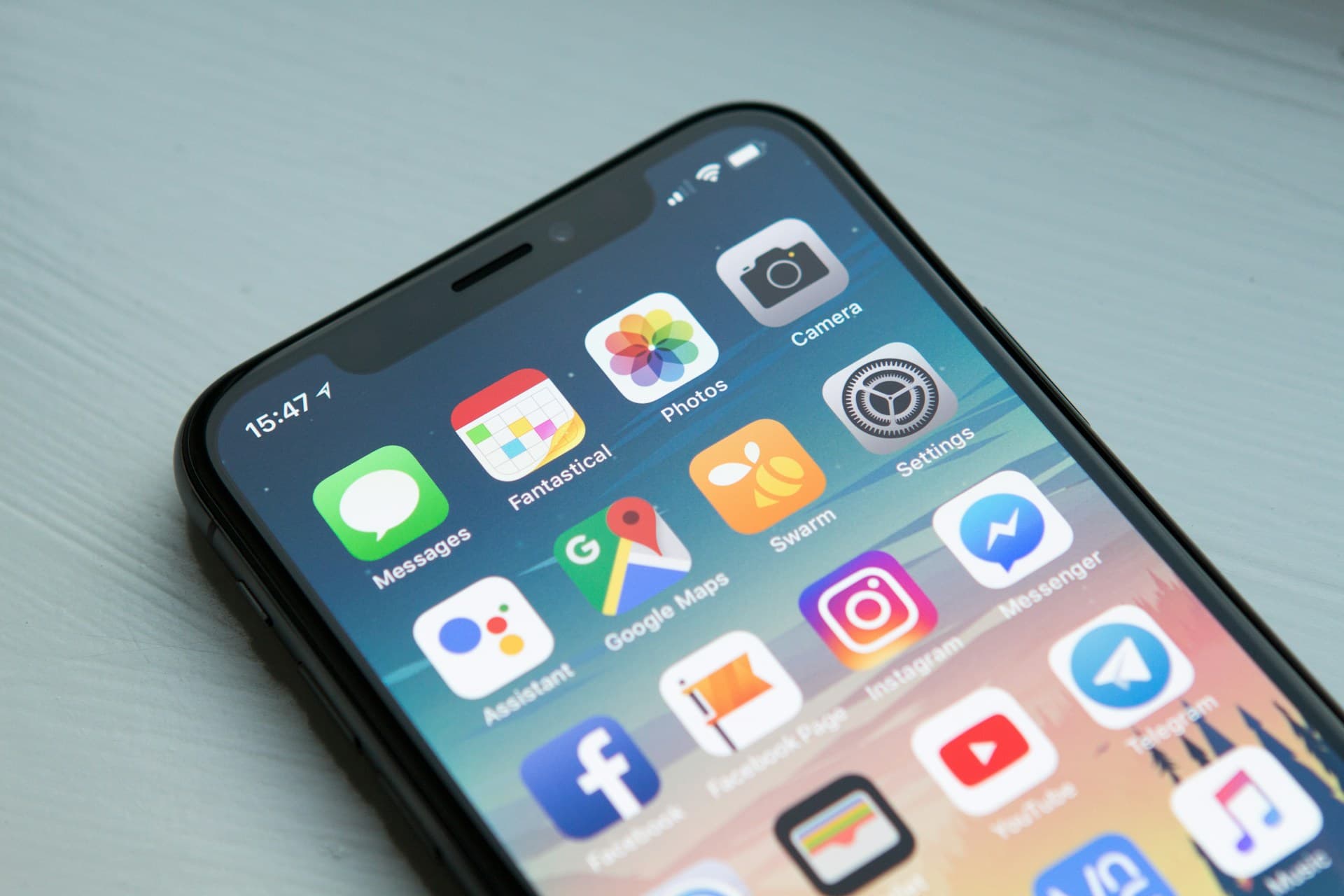 Close-up of a phone home screen showing a grid of app icons